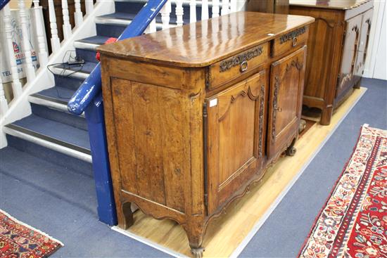 A late 18th century French provincial fruitwood side cabinet, W.138cm D.52.5cm H.94.5cm